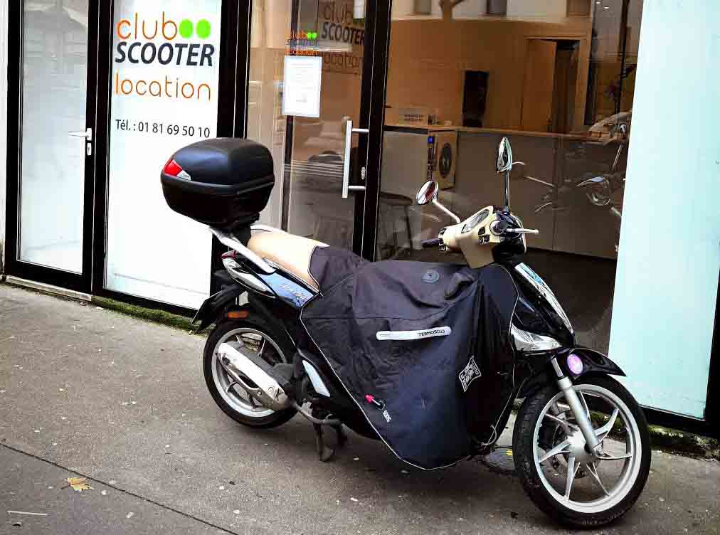 Le tablier en scooter  Club Scooter Location